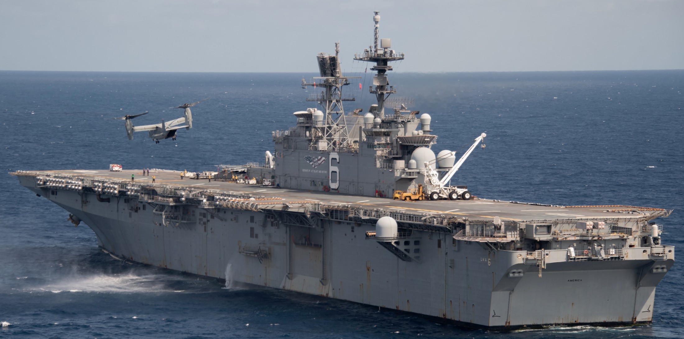 lha-6 uss america amphibious assault ship landing us navy marines mv-22b osprey vmm 204