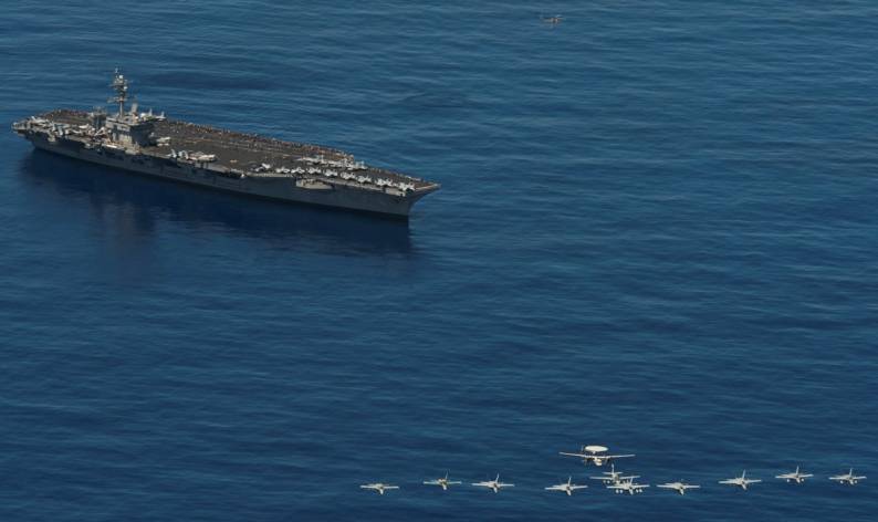 CVW-17 carrier air wing 17 aircraft fly over USS Carl Vinson CVN-70