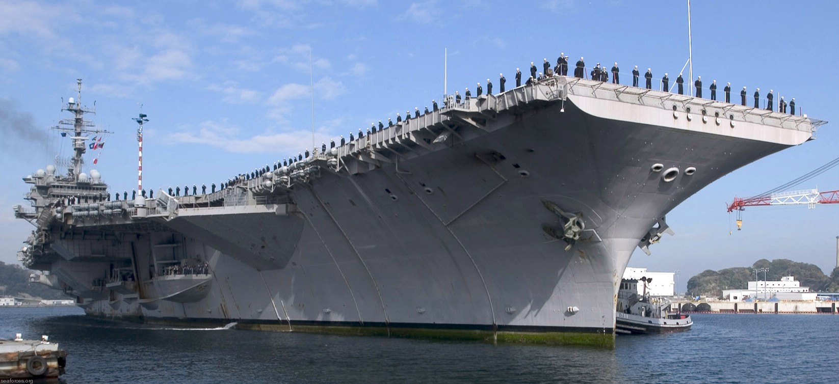 cv-63 uss kitty hawk aircraft carrier us navy 113 returning to yokosuka japan