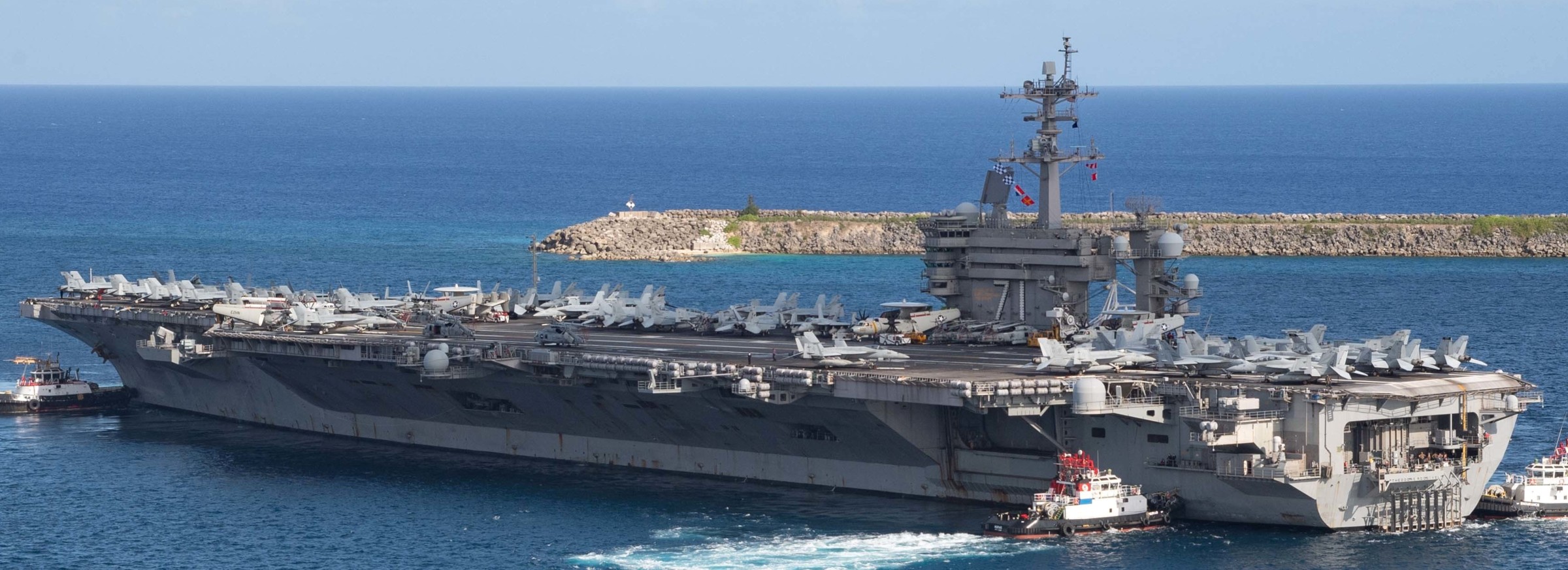 cvn-71 uss theodore roosevelt departing naval base guam apra harbor covid-19 2020