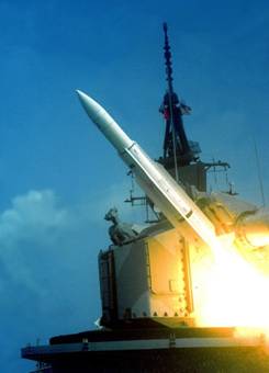USS Sampson DDG-10 fires a RIM-66 SM-1MR Standard missile from her Mk-11 missile launcher
