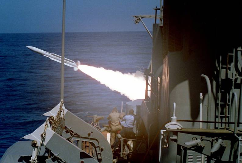 USS Goldsborough DDG-20 fires a RIM-66 SM-1MR Standard missile from her Mk-13 missile launcher