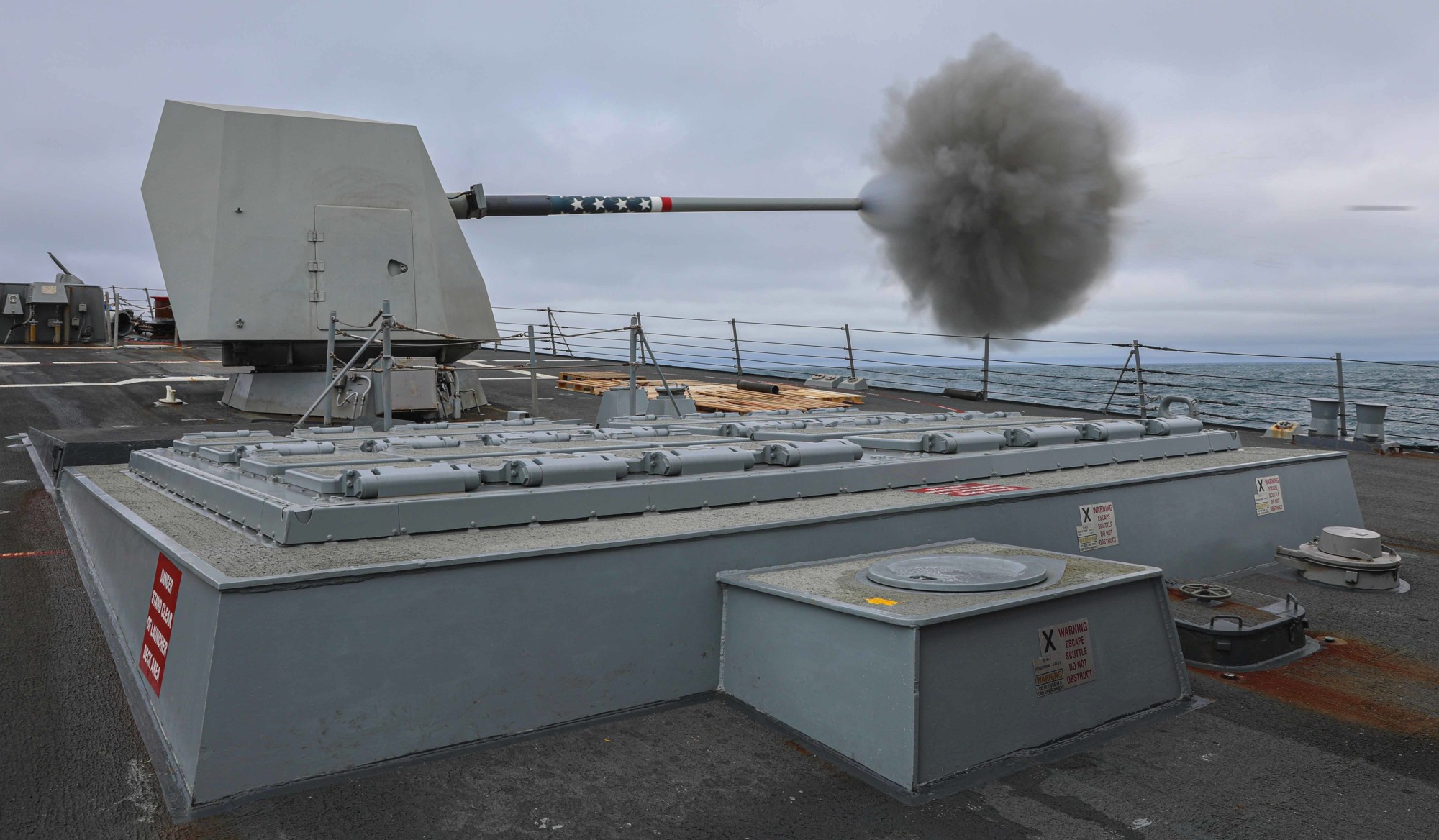 ddg-107 uss gravely arleigh burke class guided missile destroyer aegis us navy mk.45 gun fire 61