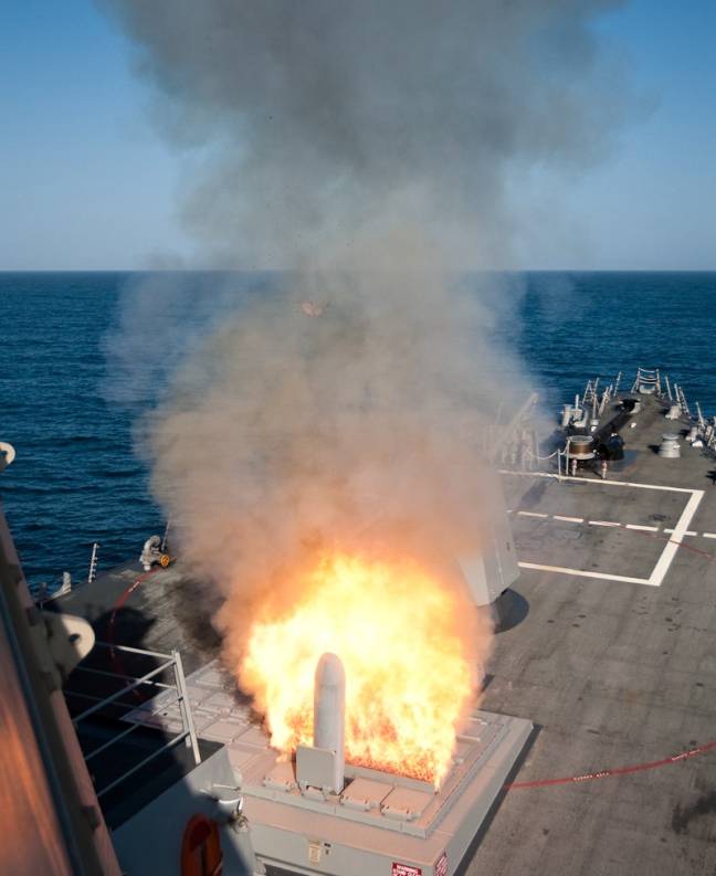 DDG-91 USS Pinckney launches a BGM-109 Tomahawk missile TLAM from her forward Mk-41 vertical launching system VLS