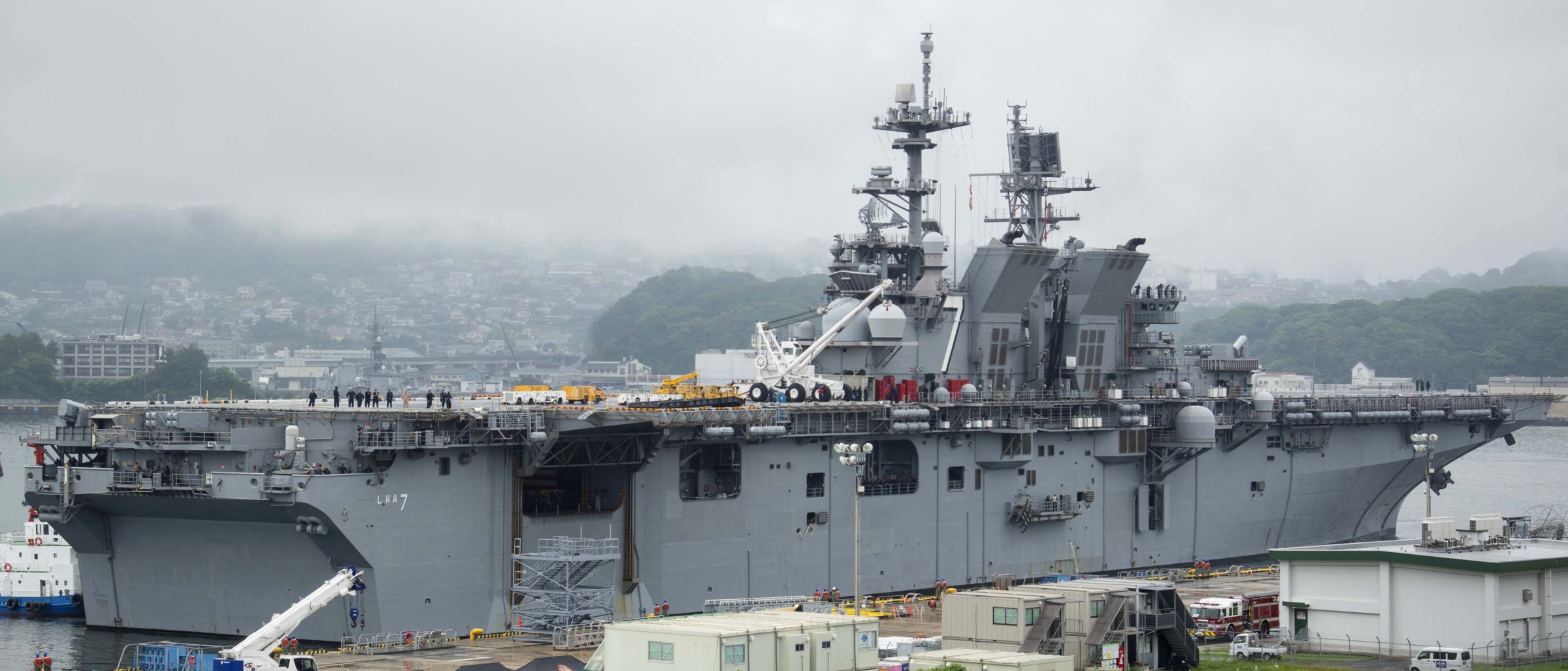 lha-7 uss tripoli amphibious assault ship arriving fleet activities sasebo japan homeport 2025