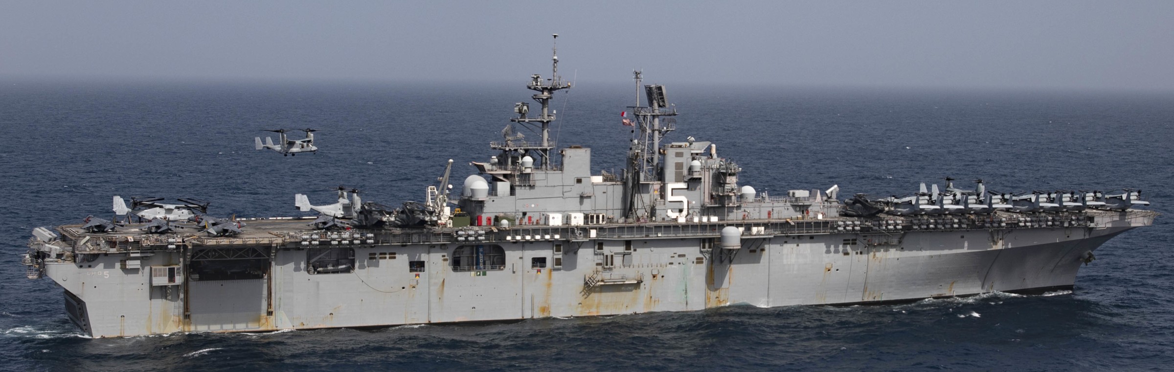 lhd-5 uss bataan wasp class amphibious assault ship dock landing helicopter us navy vmm-365 marines 155